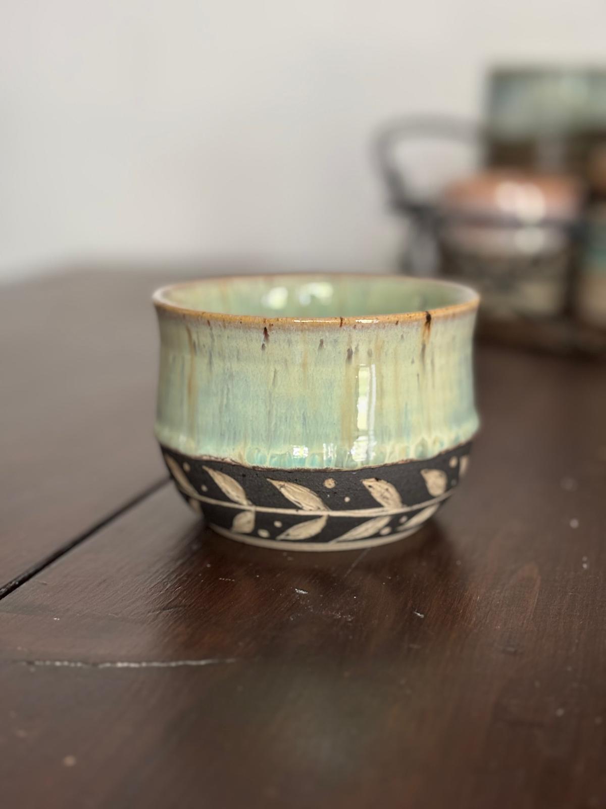Green bowl with leaves